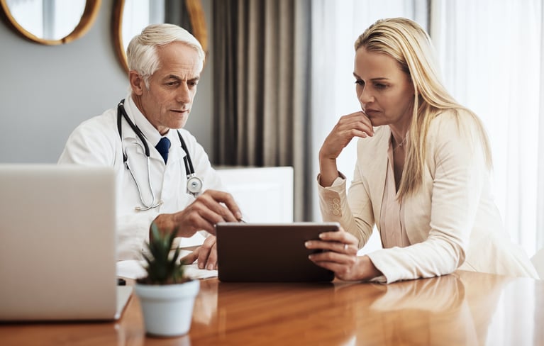 doctor-office-people-with-tablet-discussion-medical-research-coverage-advice-healthcare-worker-patient-with-tech-consultation-health-insurance-premium-database-info